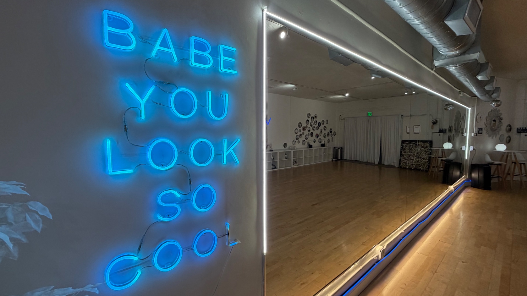 Blue neon lighting and mirrored wall